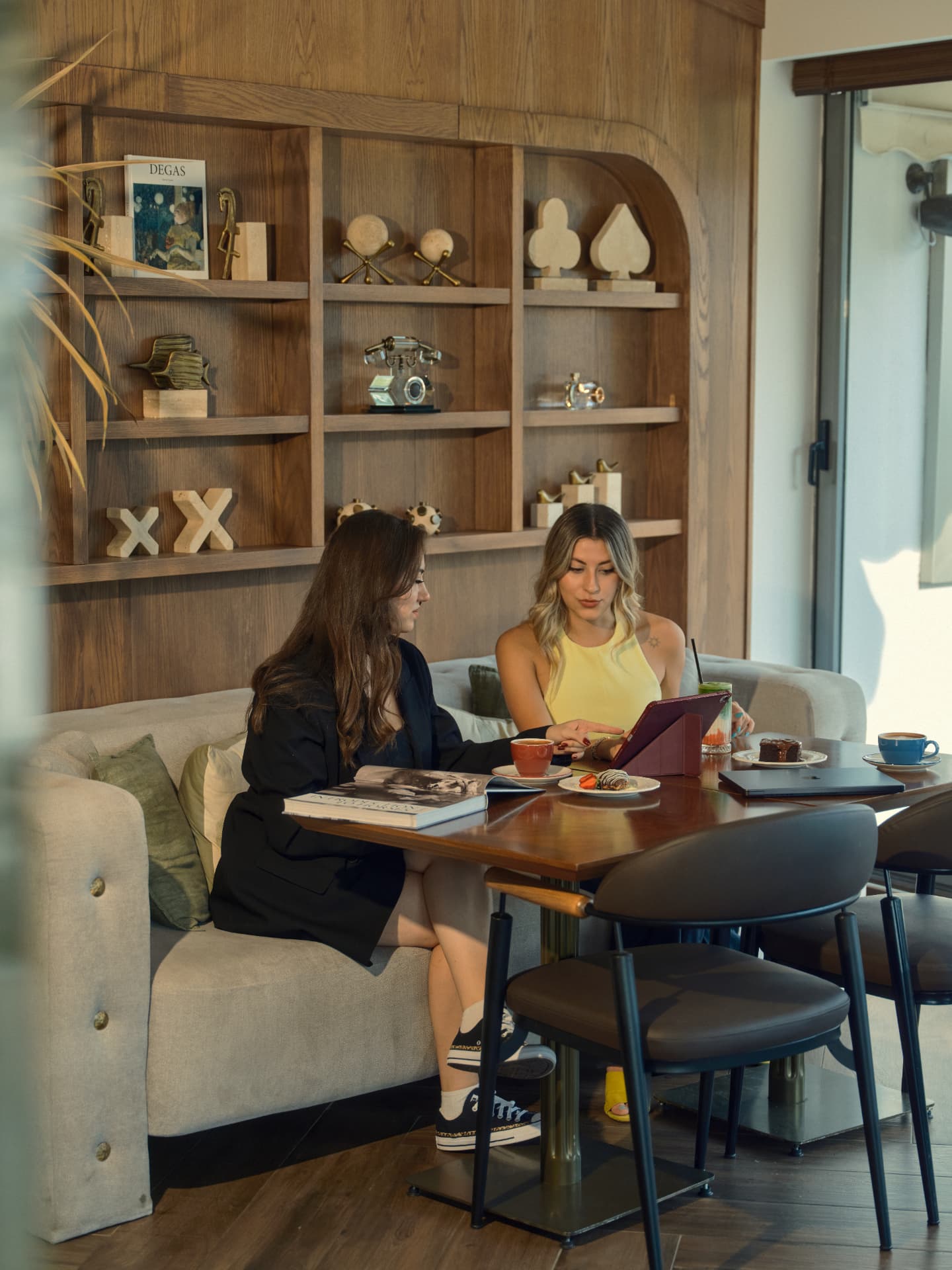 Two members talking over coffee in the Socity Club lounge